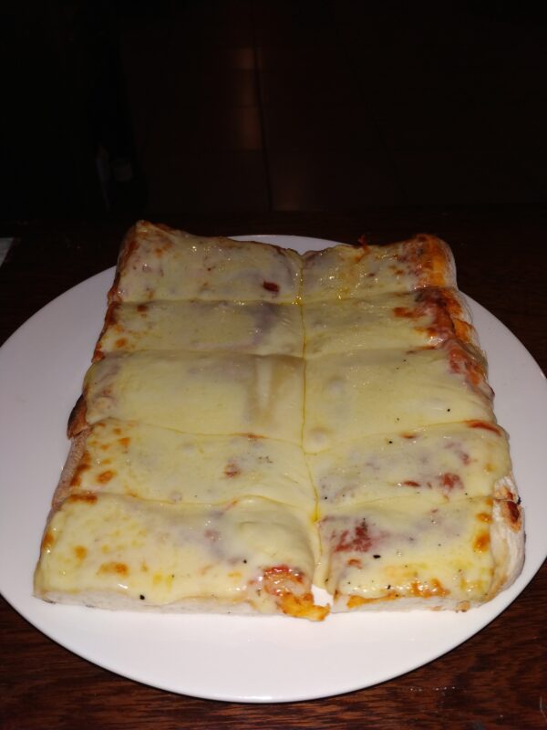 porcion pizza muzzarella